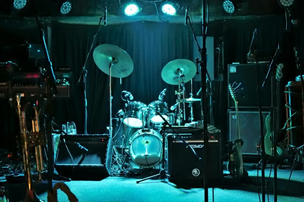An organized music stand with notes, a notebook, and an instrument case ready for a performance