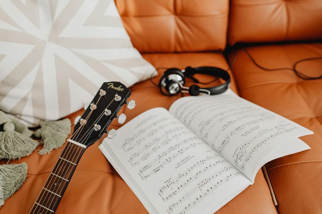A tidy home music practice setup with sheet music, a timer, and a notebook ready to go