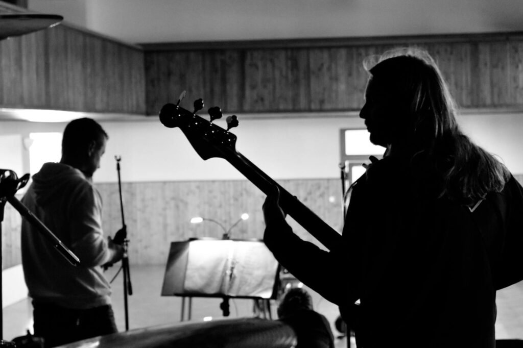 A performer sitting quietly backstage preparing before going on stage