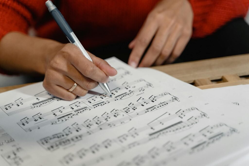 A timer and metronome beside sheet music marked with a target passage