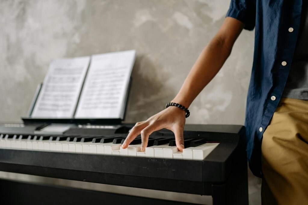 A musician marking a printed score with pencil notes before practice.