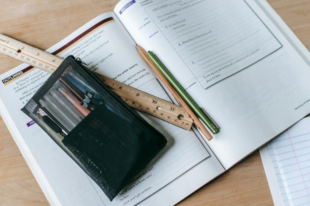 Practice desk with sheet music, pencil, timer, and a notebook for tracking progress